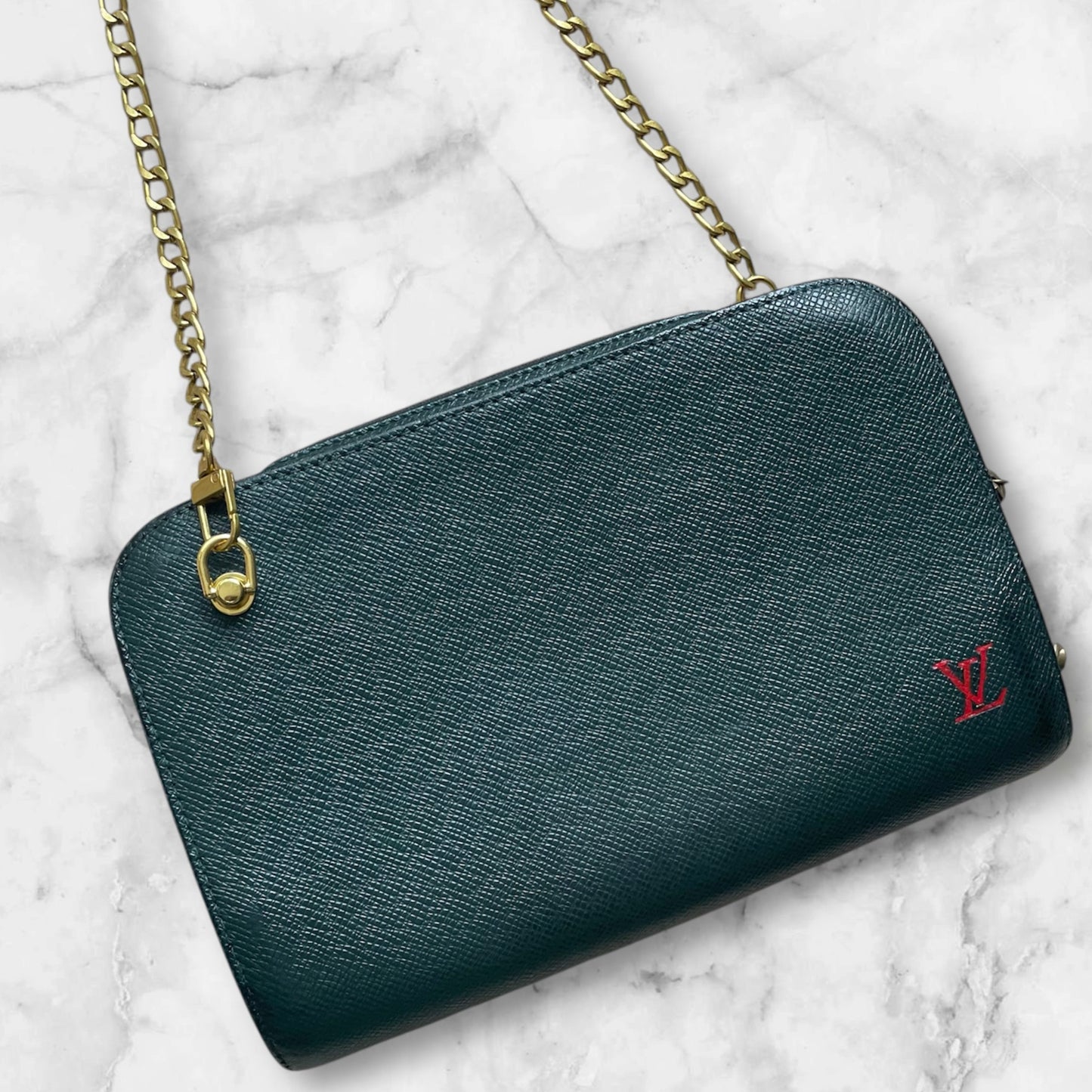 Louis Vuitton Taiga clutch crossbody