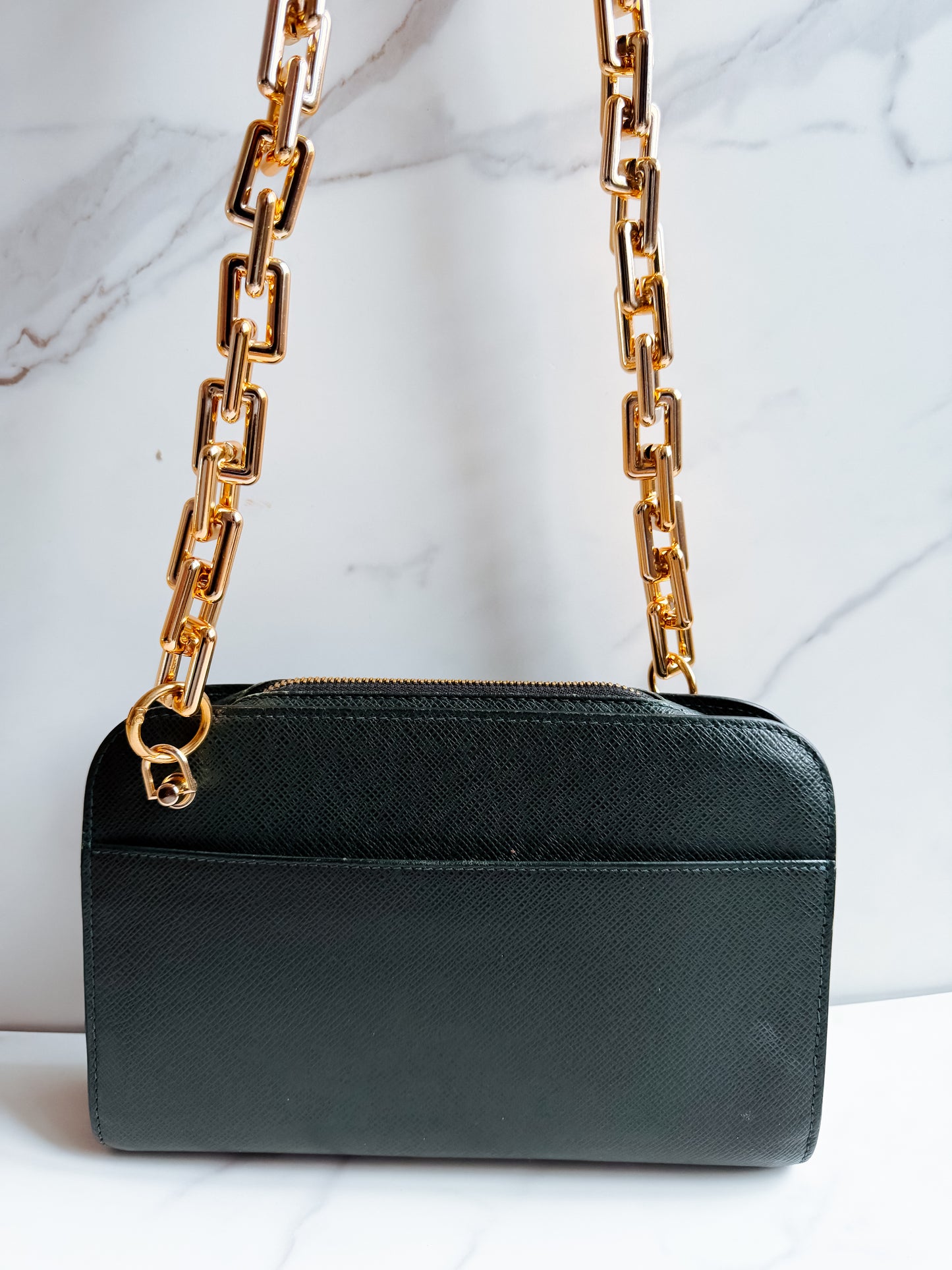 Louis Vuitton Taiga Leather clutch crossbody