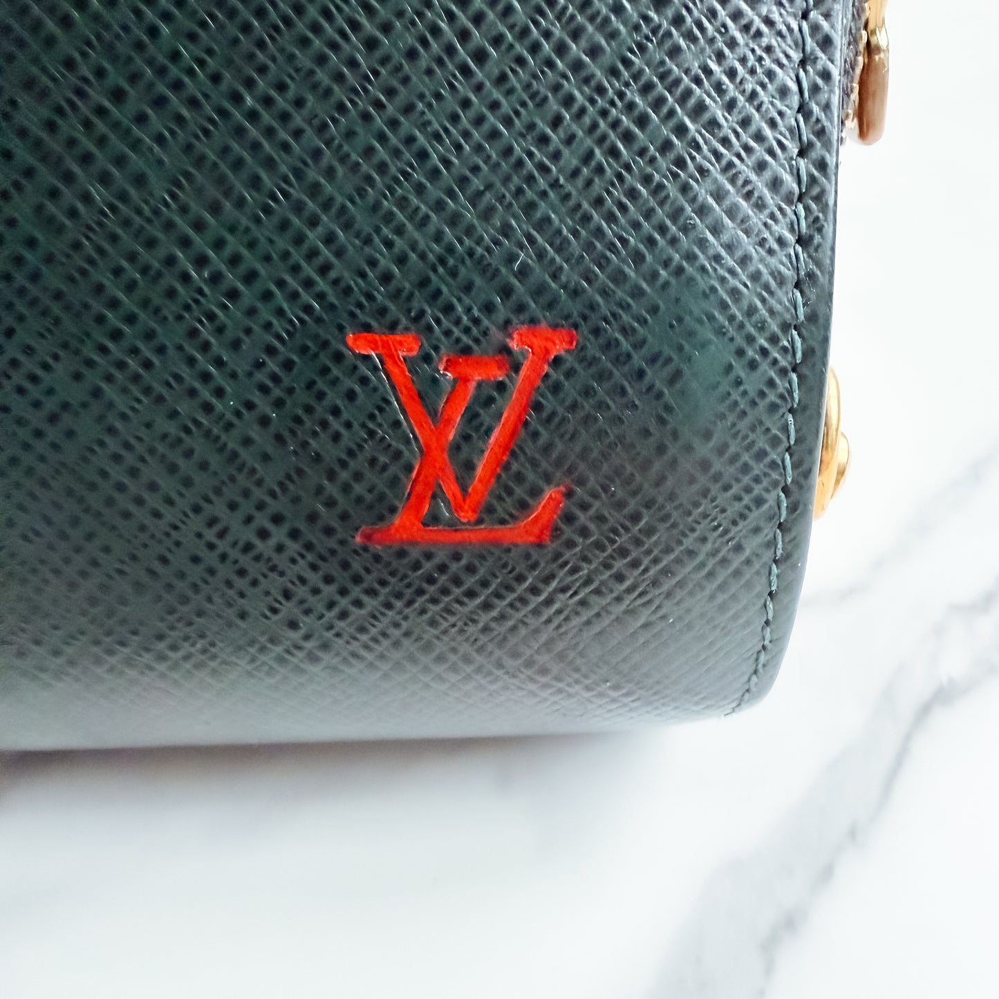 Louis Vuitton Taiga Leather clutch crossbody