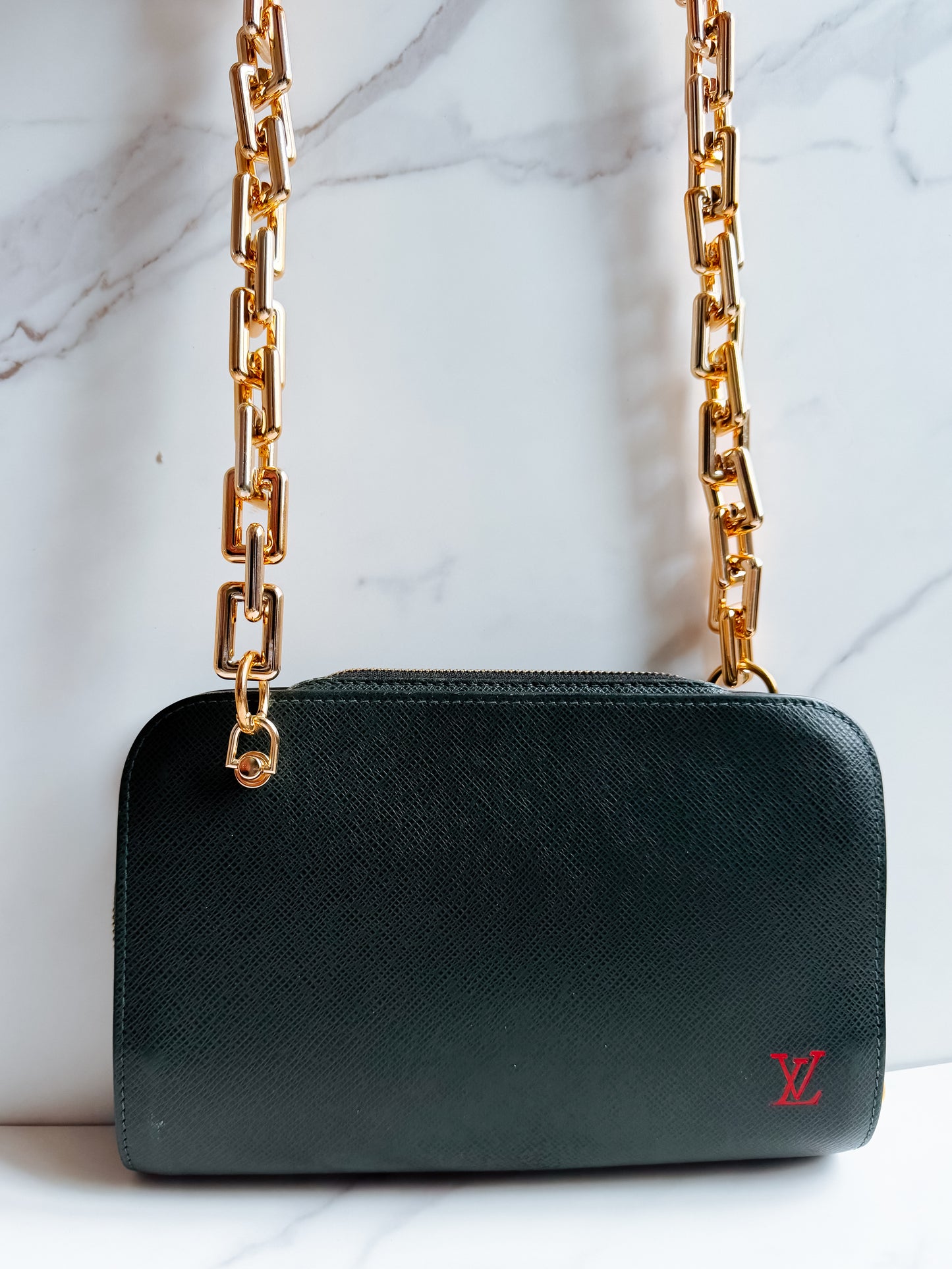 Louis Vuitton Taiga Leather clutch crossbody