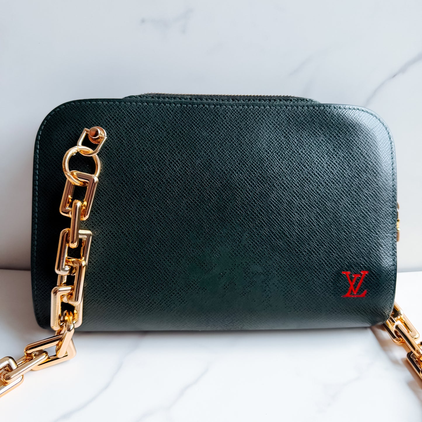 Louis Vuitton Taiga Leather clutch crossbody