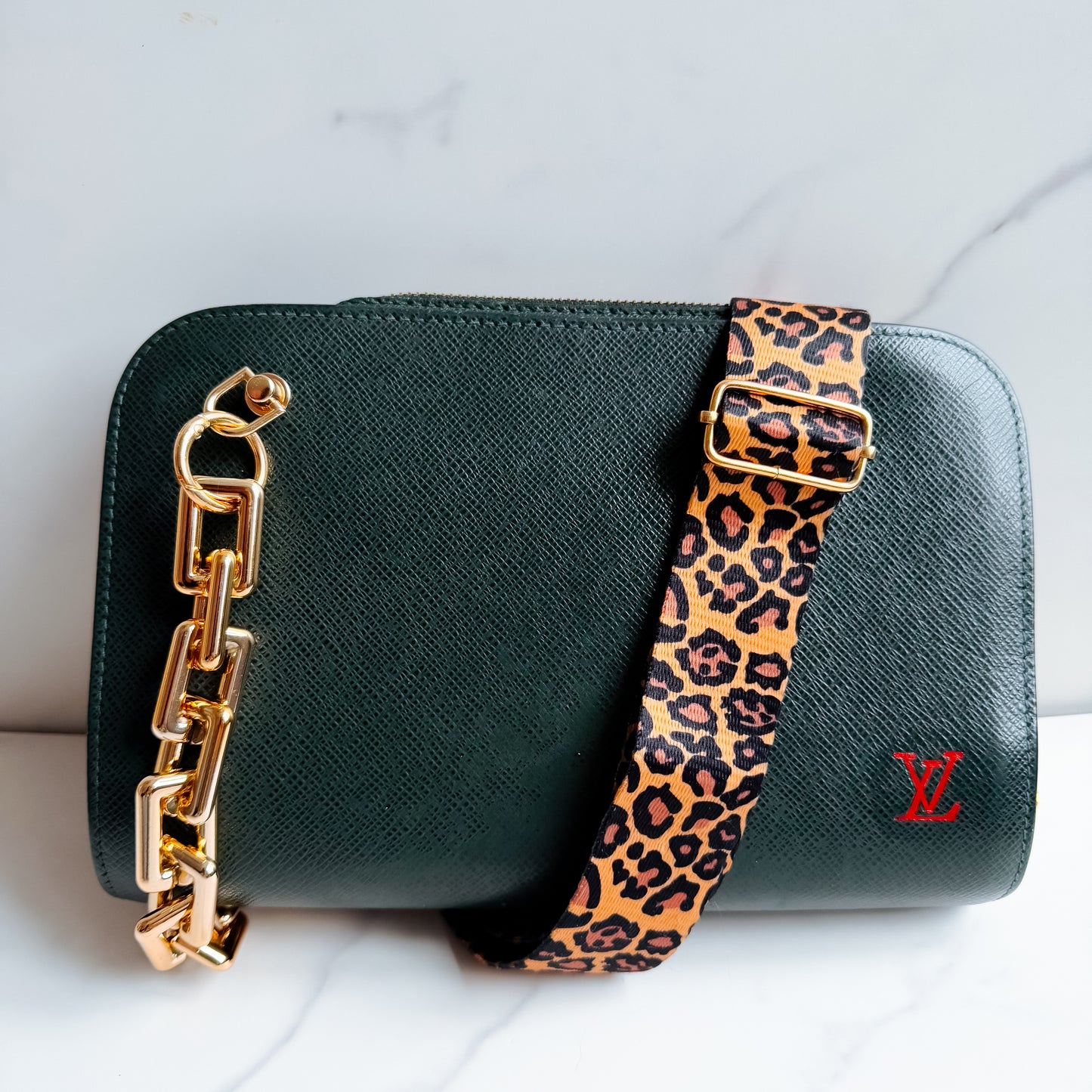 Louis Vuitton Taiga Leather clutch crossbody